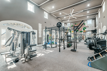 Fully-equipped fitness center with private lockers and showers